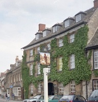 a 4 storey multi-windowed stone pub with a slate roof